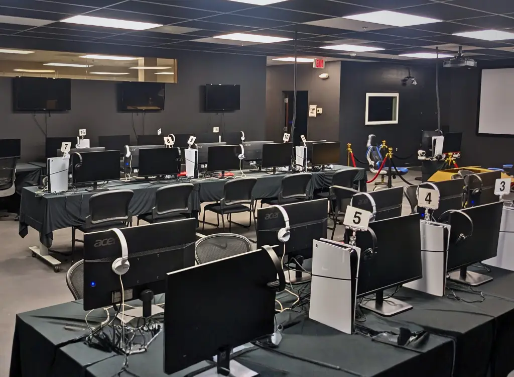 A room filled with computers and headsets.